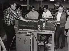 Chemcut engineers around a machine for printed circuit board production